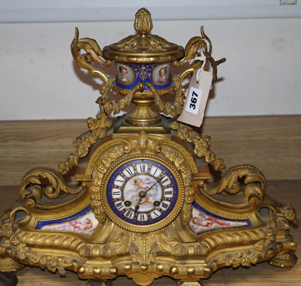 A late 19th / early 20th century French gilt metal and enamel mantel clock, height 36cm